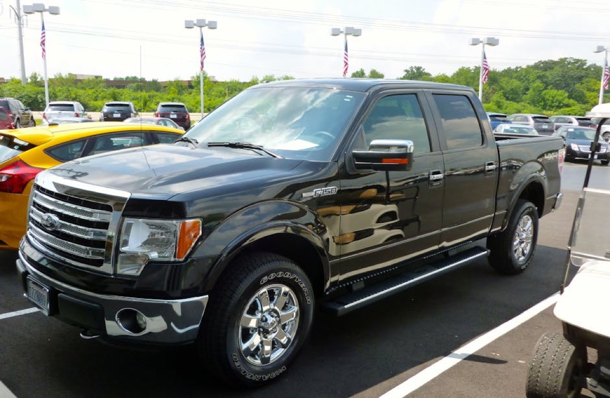 Truck dealership lot showing modern pickup trucks